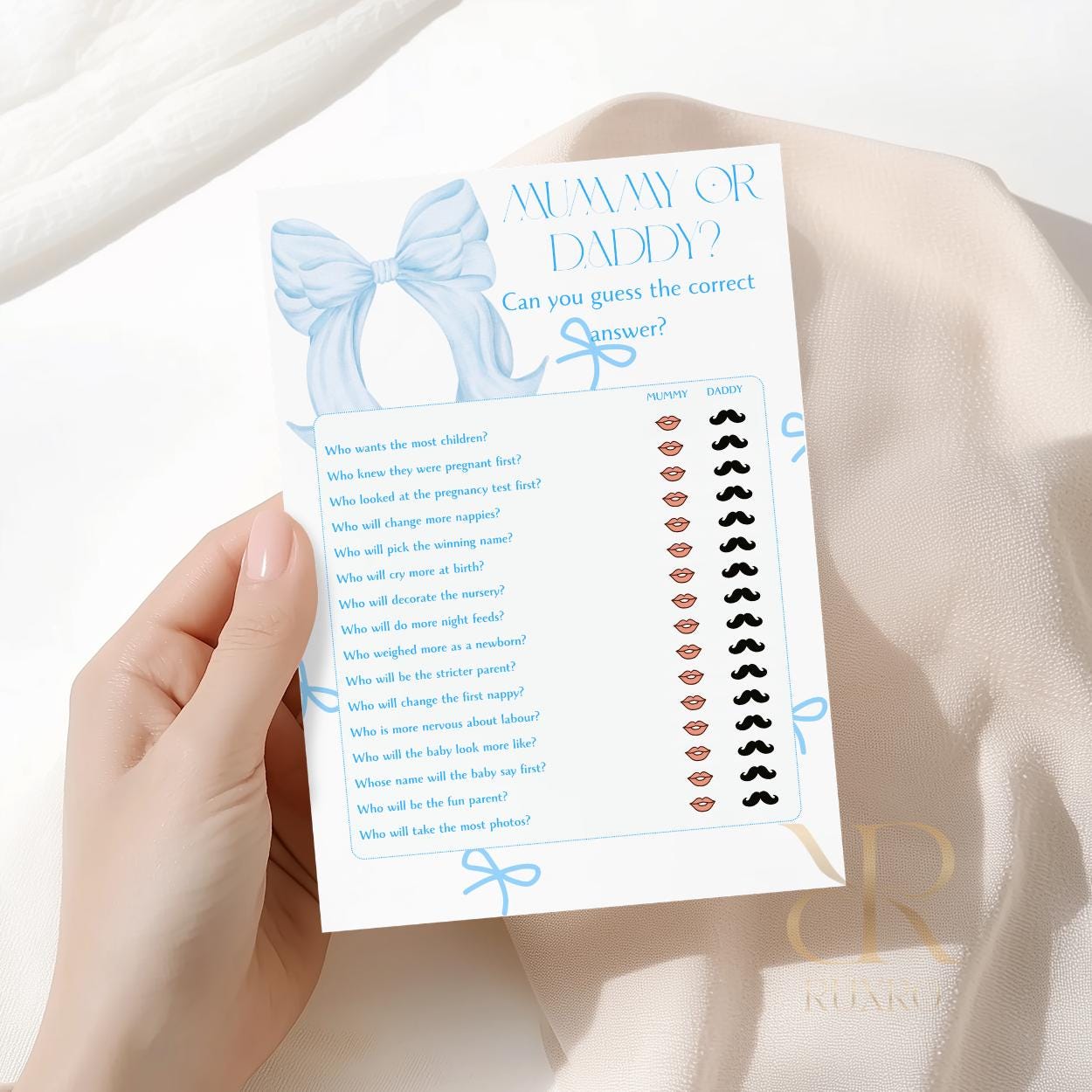 Mummy or Daddy baby shower game card in a blue bow theme
